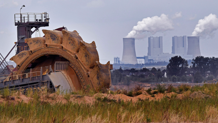 In this photo taken Aug. 27, 2018 bucket wheel digs for coal near the Hambach Forest near Dueren, Germany.