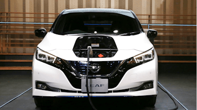 Nissan LEAF e+ is on display at the global headquarters of Nissan Motor Co., Ltd. in Yokohama Wednesday, Jan. 9, 2019. Nissan is showing the beefed up version of its hit Leaf electric car as the Japanese automaker seeks to distance itself from the arrest of its star executive Carlos Ghosn. The event at Nissan Motor Co.'s Yokohama headquarters, southwest of Tokyo, had been postponed when Ghosn was arrested Nov. 19.