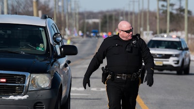 Officials respond to reports of an active shooter at a UPS facility Monday, Jan. 14, 2019 in Logan Township, NJ.