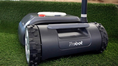 This Wednesday, Jan. 16, 2019 photo shows an iRobot Terra lawn mower in Bedford, Mass. Building a robot lawn mower seemed the logical next step for iRobot, which invented the pioneering robotic vacuum Roomba. But the company’s secret, decade-plus lawn mower project was a lot harder than anyone expected.