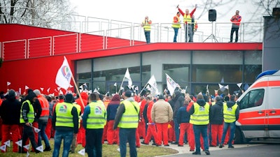 Employees of the Gyor plant of German car maker Audi AG hold a two-hour warning strike organised by the Audi Hungaria Independent Union (AHFSZ) in Gyor, 120 kms west of Budapest, Hungary, Friday, Jan. 18, 2019. The union demands a wage increase of at least 18 percent, but no less than HUF 75,000 a month. Audi Hungaria employs more than 11,500 people at its base in Gyor.