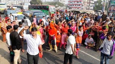 Bangladeshi garment workers participate in a protest in Savar, on the outskirts of Dhaka, Bangladesh, Wednesday, Jan. 9, 2019. Thousands of garment workers have staged demonstrations to demand better wages for the fourth straight day, shutting down factories on the outskirts of Bangladesh's capital. Bangladesh has the second-largest garment-export industry in the world after China and makes clothes for big-name retailers.