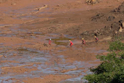 Rescue workers look for victims in the mud at a site where a hotel used to be, days after a dam collapse in Brumadinho, Brazil.