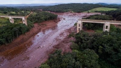 An aerial view shows a collapsed bridge caused by flooding triggered by a dam collapse near Brumadinho, Brazil.