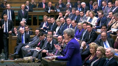 In this grab taken from video, Britain's Prime Minister Theresa May speaks, during Prime Minister's Questions in the House of Commons, London, Wednesday, Jan. 30, 2019.