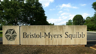 In this June 15, 2005, file photo, a sign stands in front of a Bristol-Myers Squibb building in a Lawrence Township, N.J. Bristol-Myers Squibb is buying Celgene in a cash-and-stock deal valued at about $74 billion.