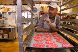 Baker Ken Bellingham, who owns Edmonds Bakery, speaks during an interview at his shop in Edmonds, Washington. Bellingham is apologizing for a politically charged Valentine's Day cookie that generated an uproar on social media.