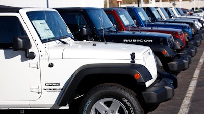 In this Nov. 1, 2009, file photo unsold 2010 Wranglers sit at a Chrysler/Jeep dealership in Englewood, Colo. Fiat Chrysler is recalling more than 1.6 million vehicles worldwide to replace Takata front passenger air bag inflators that can be dangerous. The recall covers the 2010 through 2016 Jeep Wrangler SUV, the 2010 Ram 3500 pickup and 4500/5500 Chassis Cab trucks, the 2010 and 2011 Dodge Dakota pickup, the 2010 through 2014 Dodge Challenger muscle car, the 2011 through 2015 Dodge Charger sedan, and the 2010 through 2015 Chrysler 300 sedan.