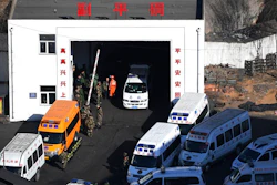 In this photo released by Xinhua News Agency, ambulance vehicles and rescuers gather at the Lijiagou coal mine of the Baiji Mining Co., Ltd. in Shenmu City, northwest China's Shaanxi Province, Sunday, Jan. 13, 2019. Twenty-one coal miners were killed when a mine collapsed in northern China, state media reported Sunday.
