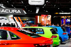 Signage for automakers Volkswagen, Acura, Chevrolet and Ford, Tuesday, Jan. 15, 2019, at the North American International Auto Show in Detroit. This year's North American International Auto Show scarcely looks different: There are gleaming vehicles, bright lights and flashy displays. But a few things are missing: BMW, Mercedes, Porsche, Audi and Mazda.