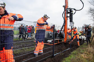 Workers erect a fence along the Denmark Germany border. Denmark has begun erecting a fence along the German border to keep out wild boars in an attempt to prevent the spread of African swine fever.
