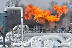 Fire comes out of the top of two silo-looking structures at the compressor station at Consumers Energy in Armada Township, Mich. Consumers Energy has called on customers to voluntarily reduce their natural gas usage following a fire at a suburban Detroit gas compressor station amid bitterly cold weather. The Jackson-based utility says no one was injured in the fire Wednesday, Jan. 30, 2019, at its Ray Natural Gas Compressor Station in Macomb County. The cause of the fire was under investigation.