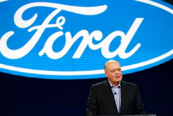In this Jan. 14, 2018, file photo Ford President and CEO Jim Hackett prepares to address the media at the North American International Auto Show in Detroit. A new version of the Ford Explorer big SUV will be shown off at the auto show starting Monday, Jan. 14, 2019, and it will have an optional hybrid power system. It is Ford’s first hybrid SUV in six years, and the company also has plans for a fully electric SUV based on the Mustang sometime next year. Seven battery-powered vehicles are planned for the U.S. by 2022, even a hybrid pickup truck.