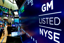 In this April 23, 2018, file photo, the logo for General Motors appears above a trading post on the floor of the New York Stock Exchange. The Canadian auto workers union is calling on people in Canada and the U.S. to stop buying General Motors vehicles made in Mexico. The Unifor union wants people to boycott vehicles with identification numbers that start with three. Unifor says it will publicize the boycott with television, newspaper and billboard ads. So far the United Auto Workers union in the U.S. is not joining the effort.