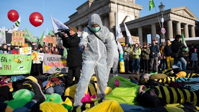 Demonstrators protest for more animal welfare and protection in agriculture on occasion of the 'Green Week' fair in front of the Brandenburg Gate in Berlin.