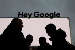 People stand in front of the Google tent during preparations for CES International, Saturday, Jan. 5, 2019, in Las Vegas.