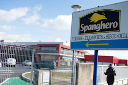 In this photo taken on Feb. 15, 2013, a person stands at Spanghero meat company in Castelnaudary, southern France. Four people are going on trial in Paris over an elaborate alleged scheme that fed consumers across Europe frozen foods containing cheap horse meat fraudulently labeled as pricier beef.