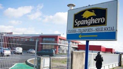 In this photo taken on Feb. 15, 2013, a person stands at Spanghero meat company in Castelnaudary, southern France. Four people are going on trial in Paris over an elaborate alleged scheme that fed consumers across Europe frozen foods containing cheap horse meat fraudulently labeled as pricier beef.