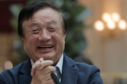 Ren Zhengfei, founder and CEO of Huawei, smiles during a round table meeting with the media in Shenzhen city, south China's Guangdong province.
