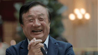 Ren Zhengfei, founder and CEO of Huawei, smiles during a round table meeting with the media in Shenzhen city, south China's Guangdong province.