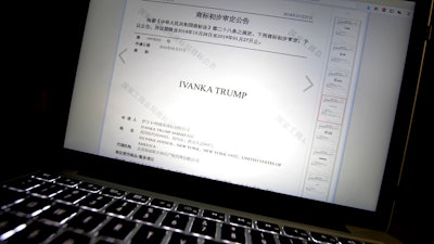 In this Nov. 6, 2018, file photo, a document from the website of China's Trademark Office of the State Administration for Industry and Commerce showing provisional approval of a trademark for Ivanka Trump Marks LLC is seen on a computer screen in Beijing. China has greenlighted five more Ivanka Trump trademarks as trade talks with her father’s administration intensify. They cover a range from wedding dresses to insurance and art valuation services.