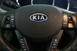 This Oct. 5, 2012, file photo, shows a Kia optima's steering wheel inside of a Kia car dealership in Elmhurst, Ill. Kia says it will ignore the partial U.S. government shutdown and recall more than 68,000 vehicles to fix a fuel pipe problem that can cause engine fires. The problem stems from previous recall repairs due to engine failures. Kia is only doing the fix on 68,000 of its 618,000 vehicles. The fuel injector pipe recall covers some 2011 through 2014 Optima cars, 2012 through 2014 Sorrento SUVs, and 2011 through 2013 Sportage SUVs, all with 2-liter and 2.4-liter four-cylinder engines.