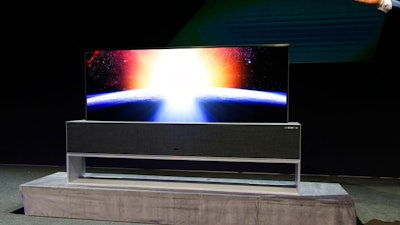 The LG Signature OLED TV R, partially rolled up, is on display during an LG news conference at CES International, Monday, Jan. 7, 2019, in Las Vegas.