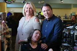 Doug Ketchum and his wife Mary pose with their daughter Stacie at their Memphis liquor store, Kimbrough Wine & Spirits.