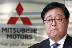 Mitsubishi Motors CEO Osamu Masuko bites his lips during a press conference at its headquarters in Tokyo Friday, Jan. 18, 2019. Masuko said the Japanese automaker's board met and discussed new allegations of wrongdoing by its former chairman, Carlos Ghosn.