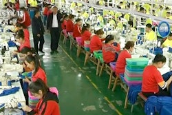 In this file image from undated video footage run by China's CCTV via AP Video, Muslim trainees work in a garment factory at the Hotan Vocational Education and Training Center in Hotan, Xinjiang, northwest China. A U.S. company that stocks college bookstores with t-shirts and other team apparel cut ties Wednesday, Jan. 9, 2019, with a Chinese company that drew workers from an internment camp holding targeted members of ethnic minority groups.