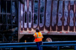 In this Thursday, Jan. 3, 2019, file photo, a worker looks at a charred semitrailer after a wreck with multiple fatalities on Interstate 75, south of Alachua, near Gainesville, Fla. The 35-day partial government shutdown stopped the National Transportation Safety Board from dispatching investigators to 22 accidents that killed 30 people, jeopardizing some perishable evidence, the agency said Monday, Jan. 28, 2019.