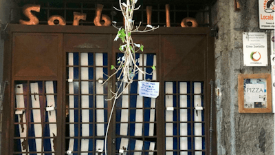 A view of the entrance to the historic Sorbillo pizzeria, in the historic center of Naples, where a bomb was detonated in the early hours of Wednesday, January 16, 2019, damaging the eatery’s metal grating.