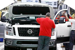 In this March 19, 2018, file photo technicians make final inspections to vehicles on the assembly line at the Nissan Canton Assembly Plant, in Canton, Miss. Nissan Motor Co. announced Thursday, Jan. 17, 2019, that it’s cutting up to 700 contract workers at its Mississippi assembly plant, citing slowing sales for vans and Titan pickup trucks that it makes there.