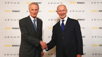 New Renault chairman Jean-Dominique Senard, left, shakes hands with Renault CEO Thierry Bollore after being appointed following a meeting of the board held at Renault headquarters in Boulogne-Billancourt, outside Paris, France, Thursday, Jan. 24, 2019. The board of French carmaker Renault has chosen new leadership to replace industry veteran Carlos Ghosn, naming Jean-Dominique Senard as chairman and Renault executive Thierry Bollore as CEO.