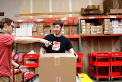 In this Nov. 16, 2018, file photo, Target employees sort boxed items from online orders to be shipped out to customers at at a Target store in Edison, N.J. For many retailers that have lifted pay to attract and keep workers, another challenge has arisen: Making those workers productive enough to justify the larger payouts.