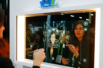 A woman demonstrates the Artemis smart mirror at the CareOS booth during CES Unveiled at CES International, Sunday, Jan. 6, 2019, in Las Vegas. The interactive mirror has video capture, virtual try-ons, facial and object recognition, and can give the user video instruction on specific makeup products, among other things.