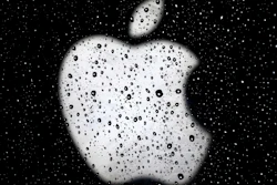 In this Dec. 26, 2018, file photo an Apple logo is seen in raindrops on a window outside an Apple Store at the Country Club Plaza shopping district in Kansas City, Mo. Apple is reducing the size of its workforce assigned to driverless car technology as the company reorganizes amid weakening sales of iPhones, its biggest moneymaker. The company acknowledged the cutbacks in a Thursday, Jan. 24, 2019, statement, without specifying the number of jobs affected. CNBC reported that more than 200 employees were dismissed from Apple’s self-driving car division, known internally as “Project Titan.”
