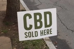 A sign outside a market in Atlanta on Jan. 18, 2019 advertising the availability of CBD.