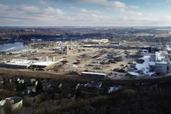 In this Nov. 21, 2018 photo, now eight months into demolition, the exterior facade of Janesville's former General Motors assembly plant remains, while much of the interior has been torn down, sorted into piles of like debris and trucked away from the grounds, in Janesville, Wis. Dec. 23, 2018, marks the 10-year anniversary of GM Janesville's main assembly lines shutting down.