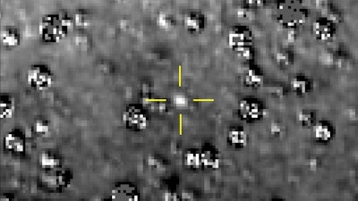 This composite image made available by NASA shows the Kuiper Belt object nicknamed 'Ultima Thule,' indicated by the crosshairs at center, with stars surrounding it on Aug. 16, 2018, made by the New Horizons spacecraft. The brightness of the stars was subtracted from the final image using a separate photo from September 2017, before the object itself could be detected.