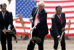 In this June 28, 2018, file photo, President Donald Trump, center, along with Wisconsin Gov. Scott Walker, left, and Foxconn Chairman Terry Gou participate in a groundbreaking event for the new Foxconn facility in Mt. Pleasant, Wis. Foxconn Technology Group said Wednesday, Jan. 30, 2019 it is shifting the focus of its planned $10 billion Wisconsin campus away from blue-collar manufacturing to a research hub, while insisting it remains committed to creating 13,000 jobs as promised.