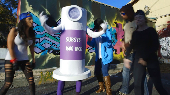 This still image from a 2015 video presented as evidence by the U.S. Attorney's Office in federal court in Boston on Wednesday, Feb. 13, 2019, shows a scene from a rap video made to motivate Insys Therapeutics sales representatives to get doctors to prescribe higher doses of the company's highly addictive fentanyl spray. Company founder John Kapoor and four other former executives are charged with scheming to pay bribes and kickbacks to physicians to induce them to prescribe higher doses. Kapoor and the other executives have denied all wrongdoing.