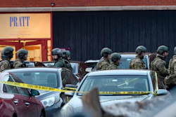 Law enforcement officers gather outside the Henry Pratt Co. manufacturing plant Friday, Feb. 15, 2019, in Aurora, Ill. Police say a gunman killed several people and injured police officers before he was fatally shot.