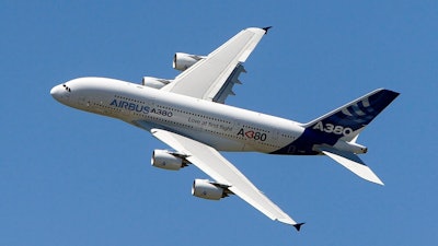 In this June 26, 2011, file photo, an Airbus A380 performs during a demonstration flight at the 49th Paris Air Show at Le Bourget airport, east of Paris. Airbus said Thursday, Feb. 14, 2019 it will stop making A380 superjumbo jets in 2021 after struggling to win clients.