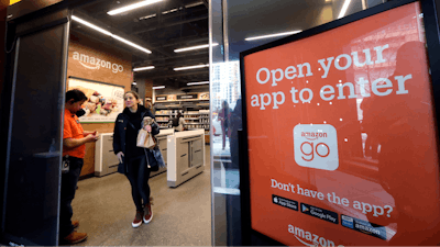 In this file photo, a shopper departs an Amazon Go store in Seattle.