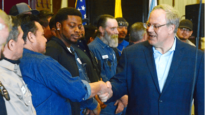 Acting U.S. Interior Secretary David Bernhardt greets employees at a Watson Hopper oilfield equipment manufacturing plant in Hobbs, N.M., on Wednesday, Feb. 6, 2019. Bernhardt visited the New Mexico city at the heart of the state's booming oil region to promote energy development on public lands.