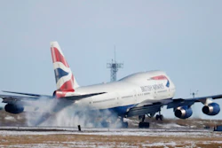 In this file photo taken late Monday, Feb. 8, 2016, a British Airways plane touches down at Denver International Airport, USA. The parent company of British Airways, International Airlines Group consortium is buying up to 42 Boeing 777 long-haul passenger jets in a multi-billion dollar deal announced Thursday Feb. 28, 2019.