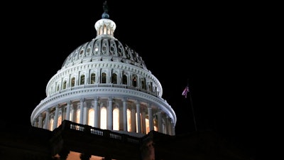In this Feb. 5, 2019, file photo lights illuminate the U.S. Capitol dome in Washington. On Thursday, Feb. 21, the Labor Department reports on the number of people who applied for unemployment benefits last week.
