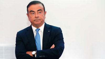 In this Oct. 6, 2017, file photo, then Renault Group CEO Carlos Ghosn listens during a media conference at La Defense business district, outside Paris. Carmaker Renault has alerted French authorities to a 50,000-euro gift from the chateau of Versailles to its former chairman and CEO Carlos Ghosn, reportedly linked to his lavish wedding there. French newspaper Le Figaro reported that the chateau allowed Ghosn to host his wedding reception on its grounds in exchange for Renault's philanthropic activities to support the Versailles estate, resplendent home to France's last kings.