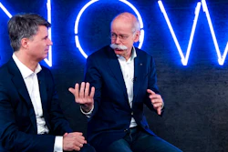 In this Friday, Feb. 22, 2019 photo Harald Krueger, left, CEO of the car manufacturer BMW, and Dieter Zetsche, right, CEO of the Daimler stock company and the car manufacturer Mercedes Benz, talk during a press conference in Berlin, Germany. Automakers BMW and Daimler said on Thursday, Feb 28, 2019 they will work together on developing the automated driving technology expected to transform the industry in the years ahead.